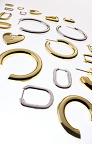 models wearing gold and silver hoop earrings